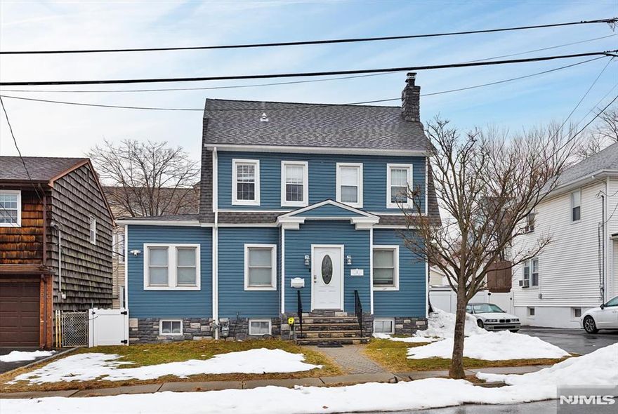 Welcome to this charming Colonial nestled in the heart of Nutley! Beautifully updated and move-in ready, this spacious home offers the perfect blend of classic character and modern upgrades all priced to sell. Step inside to discover beautiful hardwood floors throughout the living room, highlighted by a cozy fireplace perfect for relaxing evenings at home. The remodeled kitchen features stainless steel appliances, a convenient breakfast bar, & plenty of space for cooking and gathering. Also, a powder room off kitchen for guests. The floor plan offers 4 bedrooms, with the potential to use two additional rooms as bedrooms, den, or a home office ideal for today's lifestyle needs. The walk-up attic has been thoughtfully converted into a spacious bedroom, providing even more living space. The second floor includes 3-4 bedrooms & a full bath, offering comfort and convenience for everyone. The remodeled finished basement is designed for entertaining, complete with a half bath and dedicated laundry room, a perfect setup for movie nights, game days, or hosting guests. Outside, enjoy your own private oasis! Brand new vinyl siding & fencing. The backyard boasts beautiful paver patio, and a sunken pool just in time for those hot summer days. Conveniently located near parks, schools, shopping, and NYC transportation, this home truly offers the best of suburban living with easy city access. Don't miss this incredible opportunity this one won't last!