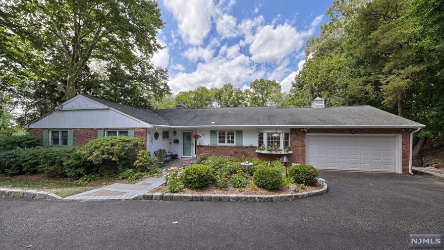 Meticulous Packanack Ranch offers 4 Bedrooms, 2.1 renovated baths plus a huge walk-out ground level to Grecian Style heated Gunite pool w/spa (on a separate gas meter) & cabana. This beautiful home is nestled on over 1/2 acre w/seasonal vistas of the Lake & tucked away offering privacy. Spacious foyer leads to a updated EIK enhanced w/all SS appliances, granite & cherry cabinets. Living & Dining Rm is ideal for entertaining, WB fireplace for intimate gatherings & oversized picture windows overlooking pool & glowing sunsets.Spacious MBS w/en-suite bath. Lower level is the perfect retreat w/a Family Rm w/gas fireplace, 1/2 bath, game, exercise area, immense amount of storage, private office, cedar closet & laundry. A delightful 3 season porch providing access to patios & walkways to pool. Features include; newer windows, hw floors,fenced in yard, generator hook up & dog run.Short distance to the Lake that is filled w/amenities for all, enjoy pickle ball, tennis, swimming, fishing