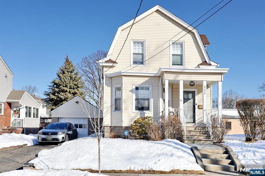 Welcome to this well maintained 2 BR, 1 1/2 bath classic Colonial offering comfortable living space with a mix of character and updates. Enjoy an inviting front porch with a craftsman front door. 1st floor features an entry foyer leading to living room, spacious dining room, updated kitchen with granite countertops, powder room and door to backyard. Hardwood floors, recessed lighting. Perfect for everyday living and entertaining. 2nd floor offers two nice size bedrooms and a large full bath. The finished basement adds flexible space for a recreation room, home office or workout area, laundry area and walk out to backyard. Enjoy a beautiful fenced in yard, new paver patio and storage shed. Ideal for relaxing and enjoying a nice barbecue. Central air, 1-car garage and an EV charger. A wonderful opportunity to own a home and enjoy great outdoor space. Close to schools, parks, shopping, dining and NYC Transportation. A must see home!