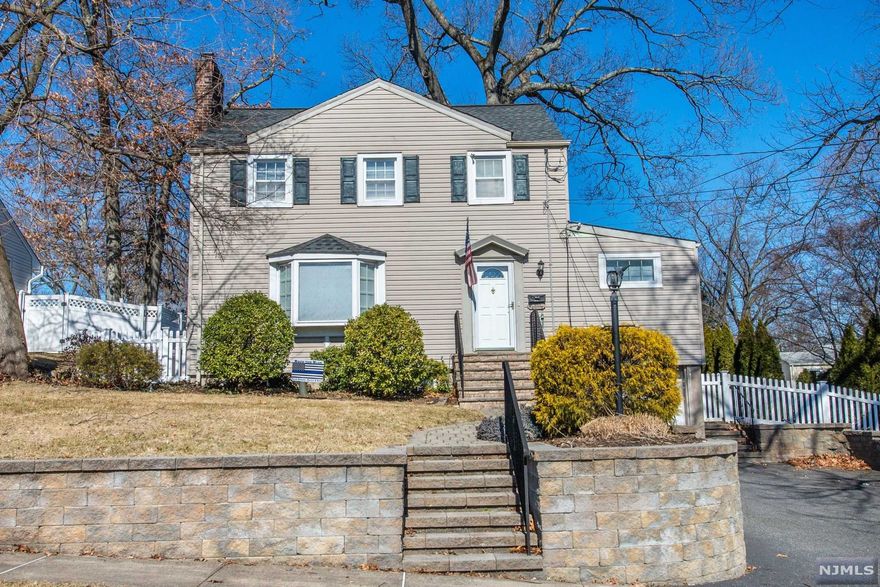 Charming 1940s colonial with warmth and character. The home was recently repainted and is move in ready. The kitchen has white shaker style cabinets, quartz counters and a built-in table with storage. Living room with beautiful fireplace, recessed lighting and a large picture window which brightens the room. Work form home? Enjoy a first floor home office (or family room) with sliding glass door to deck. Well sized master bedroom with a custom closet system. A family room and finished basement offer recreation space or office space and storage. Other features include an attached garage, large deck, wide yard, and close proximity to Traphagen school (a Blue Ribbon school), parks, town and train and bus transportation.