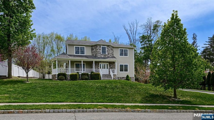Welcome to 14 De Hart Ct., tucked away on a quiet cul-de-sac and introduced by a charming front porch perfect for morning coffee, evening unwinding or simply enjoying the peaceful setting. Built in 2013, this impressive Center Hall Colonial offers over 3,200 sq ft of sun-filled living space plus a finished basement. Featuring 4 Bedrooms, 2.1 Baths and hardwood floors throughout, this home blends timeless design with everyday functionality. A spacious foyer is flanked by formal Living & Dining Rms, leading to a striking Great Rm anchored by a floor-to-ceiling stone gas fireplace. The open-concept Kitchen is designed for both style and function, showcasing granite countertops, SS appliances, a center island w/ breakfast bar, separate dining area and a walk-in pantry. A Powder Rm completes the main level. A door from the dining area leads to a park-like level yard and paver patio ideal for seamless indoor-outdoor entertaining. Upstairs, the expansive Primary Suite offers two WICs and a spa-like en-suite bath w/ walk-in shower, soaking tub and water closet. Three additional Bedrooms (two w/ WICs), main bath, laundry and attic access complete this level.The fully finished lower level expands the living space w/ high ceilings and designated areas for a Rec Rm, Gym and Media. Additional features include a 2-car garage with Ev charger,multi zone sprinkler and central air. Ideally located near schools, shopping and major highways this home checks every box!