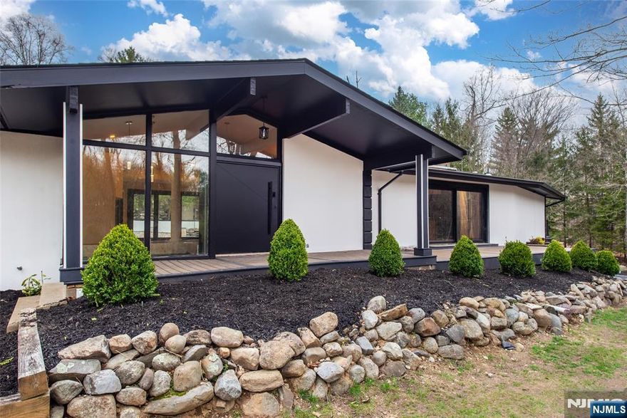 Each of Four En-Suite Bedrooms generously sized bedrooms boasts its own private, updated bathroom, offering ultimate convenience and privacy. Additional Half Bathroom is conveniently located for guests, Heated granite floors The brand-new, custom-built kitchen is a chef's dream, featuring high-end Dacor stainless steel appliances, a wine cooler, and a skylight that floods the space with natural light. Energy efficiency and natural light abound with windows and sliding doors. Expansive New Deck Perfect for outdoor dining, lounging, and entertaining. Essential Updates: Peace of mind with a new roof, new gutters, new septic system, and a new driveway, Cozy Fireplace. Extra Basement Bonus Space A significant additional living area with direct access to the pool. 1.5 Bathrooms: Includes a full bathroom and an additional half bathroom for convenience. Gaming Space: Perfect for recreation and entertainment. Enjoy the warmth and charm of two fireplaces in the lower level. Agent related to seller