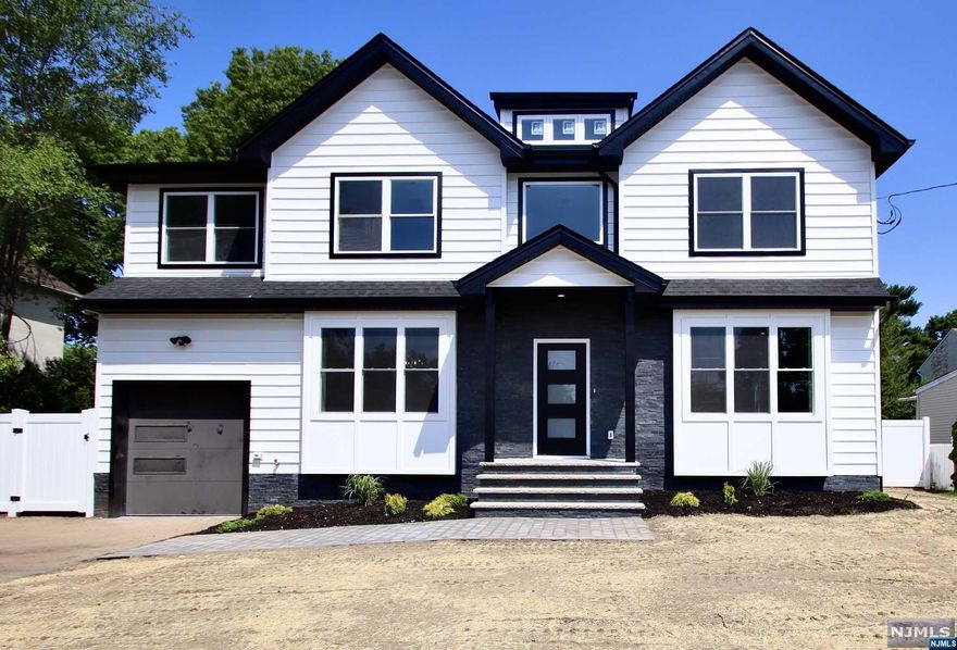 Stunning New Construction on Existing Foundation in sought after area of Fair Lawn - Upon entering this 5 Bedroom, 3 full bath center hall you will see the latest style railings going up to 2nd floor - 1st floor features 9 ft ceilings, LR, Formal DR, Fam Rm, Mod Kitchen with island and SGD to large Deck, mudroom off the garage, Bedroom, full Bath - 2nd floor features 4 Bedrooms(master with full bath and walk in closet), and Laundry - finished basement has high ceilings - wain coating, 2 zone A/C and 2 zone Heating, fenced in yard - walk to houses of worship, ny trans, and bike path - Fair lawn has many activities for all ages, town pool, parks, community center, senior center, etc - Fair Lawn voted in top 5 towns to live - Great place to raise a family