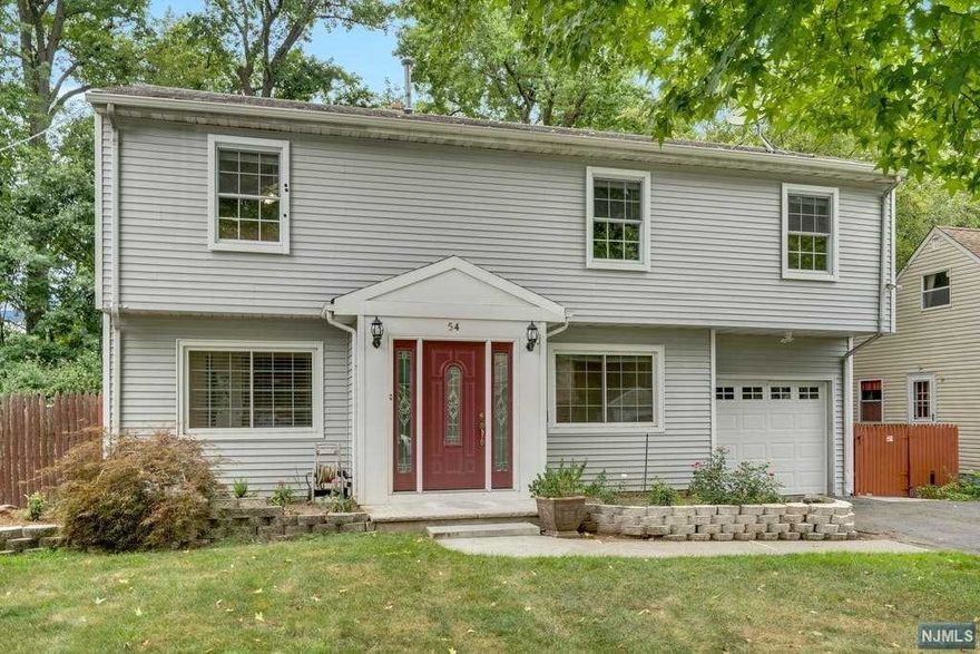 Move right into this magnificent sun-drenched spacious, Gorgeous & completely updated big Colonial house on most desirable street in Bergenfield on quiet dead-end street & close to Tenafly border. House is much bigger than it looks. Extra large rooms. Living, Dining, 4 big bedrooms, 2 Full Baths, Office room, Full Finished Basement with Office, Utility & Storage. Huge Master bed suite with 3 closets. Hardwood Floors, Expensively Updated Kitchen with granite Countertops, Center island, custom backsplash, top branded Stainless Steel Appliances, Recessed lights. Expensively updated both baths with custom tiles and accessories. Open Kitchen to Dinning Area w/ Center Island, Large Windows Overlooking the Large Deck and Back Yard. Plenty of Closets & Custom Organized. Fresh paints. Public Sewer, Public Water, Gas Heat, Central heat & Central Air conditioning. 2nd Heating unit and Central Air are installed. Large Deck & Back Yard. Multiple offers received. Best & final by 12/7 5:00 PM.