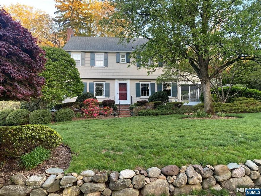 Your search is over. Come right into this welcoming 5 BR, 3.5 bath Colonial in the Ridge School district. The center hall opens to the spacious LR on the left with a pretty mantel and gas-fired fireplace. Turn right from the hall into the formal DR with 2 built-in corner cabinets. A door opens to a seasonal screened open porch, a summertime favorite. The kitchen, pantry and breakfast area are a focal point of the house. Cherry wood cabinets, granite counters with tile backsplash and top-of-the-line appliances make this a cook's dream. Follow through these rooms to the Den, a circular floor plan so convenient for entertaining and everyday living. The 2nd floor has 4 corner BRs and 2 baths. The large Primary Suite has 2 well-organized closets and tile bath with glass enclosed shower. The hall bath was renovated in 2022 2 sinks, quartz counter, tub, glass enclosed shower and tile floor. Stairway to the 3rd level leads to the 5th BR/office, bath and large paneled attic storage. Lower-level basement is partially finished with a large Family Room and built-in work bench as well as the utility/laundry room. A door leads to the 2-car garage with electric door openers and access to the back yard. Situated at the corner of 2 cul-de-sac streets, the house is surrounded by lovely gardens and play areas. The patio is off the kitchen and porch with stone steps to a flat, grass yard. Gas heat, CAC, inground sprinklers...move right in and make this your own!