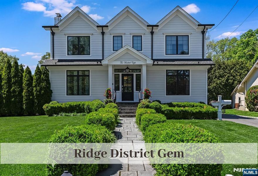 Stunning Ridge District Center Hall, just moments to Town, Train & Schools, provides superior craftsmanship, lux material selection, cutting-edge Smart Systems & desirable lifestyle features. Hardie Plank siding, Pella windows, and a bluestone walk flanked by boxwood hedge to covered entry appoint this impressive 2018 renovation. The entrance foyer, w/front-to-back sunlit views, greets and sets the stage. Banquet dining w/fpl has a nearby Butlerâ€™s Pantry w/wine fridge. Chefâ€™s Dream Kitchen & Heart of Home offers custom cabinets, 9-ft quartz island, Miele stove, oven & dishwasher, glass tile backsplash, walk-in pantry, & Sub-Zero fridge (36 in)/freezer (24 in). All seamlessly flow to the eat-in area, oversized family rm, and French doors to patio for convenient entertaining. 1st-floor bedrm/home office has nearby full bath. Outstanding storage. Primary bedroom w/10x12 WIC has lux en-suite bath w/water closet, twin marble vanities, & soaking tub. 3 generous corner bedrooms w/custom California Closets, charming & well-appointed hall bath, laundry & lrg linen closet complete the 2nd fl. Lower level w/rec room, play room, home gym, and half bath has tons of storage. Privacy arborvitaes & black aluminum fencing surround oasis rear yard w/bluestone covered patio. 2-car garage w/2nd-story storage. 6-zone sprinkler, Lutron Smart Lights, Denon Heos speakers/surround sound, VIVINT security, whole house generator, Hunter Douglas custom shades, and glowing 4-in white oak flrs. A must-