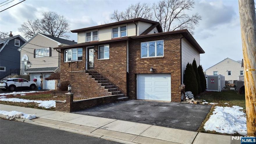 Immaculate and move in ready, this beautifully maintained 4 bedroom, 4 bathroom cape offers the perfect blend of space, comfort, and style. Enjoy bright living areas with skylights, a large formal dining room, and a large living room. The fully finished ground floor features a huge family room, wet bar, in wall speakers, and a modern electric fireplaceâ€”ideal for entertaining. Outside boasts a Trex deck and 22 foot above ground pool, perfect for summer fun. With central air, hardwood floors, a 4 zone heating system, and a two car tandem garage with extra storage, this home checks every box. Conveniently located near schools, parks, NYC transportation, and major highways, it combines comfort, convenience, and community. Schedule your showing today!