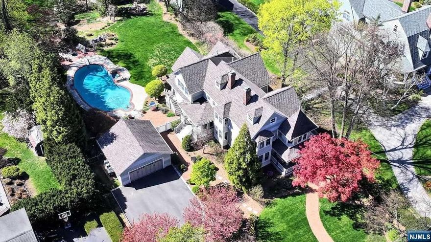 Located on a premier street in the heart of Ridgewood,this beautifully expanded Victorian Colonial merges timeless charm with contemporary living,offering a one-of-a-kind private oasis.Highlights include a sun-filled spacious EIK,office,large pantry,and 2nd-floor LDRY.The expansive primary suite boasts 2 WIC,a gas FRPL,and overlooks a lush yard.The walk-up 3rd-floor offers space for a 5th BR/flex room.High ceilings,large windows,and window seats make this an architectural gem.The lower level features additional living space,FB,and a gym area with walk-out access to the patio/pool area.Outdoor features include lemonade porch with swing,pool,and barn,providing endless opportunities for relaxation,recreation,and entertaining.Nestled on professionally landscaped 0.8 acres, this property offers privacy while being conveniently located near downtown amenities,schools,and public transportation.Enjoy the best of Ridgewood living with the perfect balance of seclusion and accessibility!