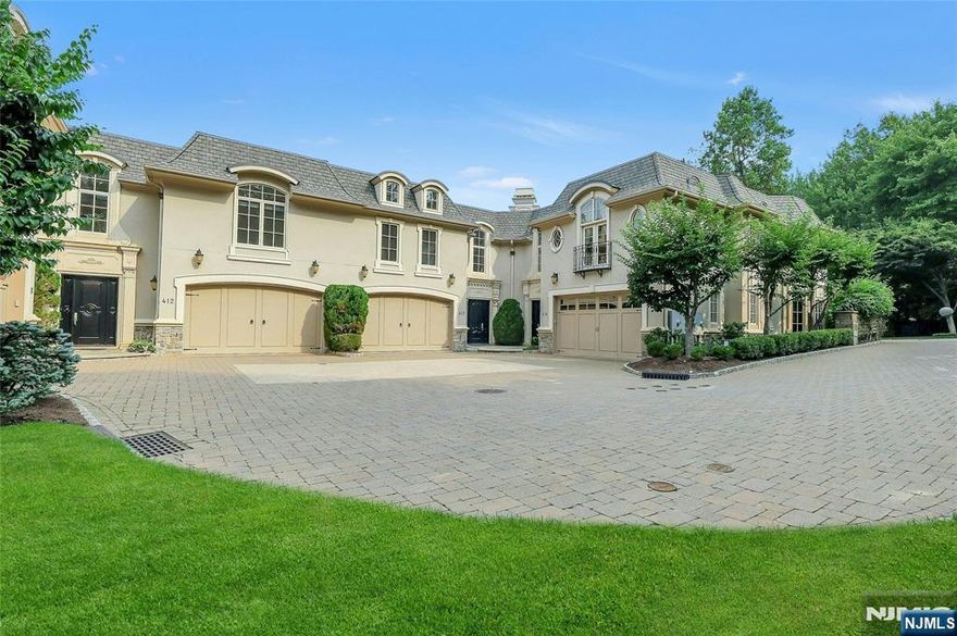 EXPERIENCE EXCEPTIONAL ELEGANCE IN THIS STUNNING BELLAIRE TOWNHOUSE, NESTLED IN THE HIGHLY SOUGHT-AFTER GATED COMMUNITY NEXT TO ALPINE CC. SURROUNDED BY LUSH GREENERY ON THREE (3) SIDES, THE MOST PRIVATE N SERENE SETTING WITHIN THE BELLAIRE ENCLAVE. THIS HOME OFFERS 6,000 SF OF TIMELESS EUROPEAN CHARM N MODERN SOPHISTICATION. A CHARMING INTERIOR W/ ELEGANTLY DESIGNED CURVED STAIRCASE, BEAUTIFUL HARDWOOD FLOORS, CUSTOM MOLDINGS, N TRIM WORK, N HIGH CEILINGS. OPEN FLOOR PLAN W/ ELEVATOR TO ALL 3 LEVELS. CUSTOM MAHOGANY LIBRARY W/ COFFERED CEILING. GOURMET EAT-IN KITCHEN W/ TOP OF THE LINE APPLIANCES, SUB ZERO N VIKING, W/CENTER ISLAND. DINING AREA, GREAT RM W/FIREPLACE. A CLASSY PRIMARY SUITE W/ A SEPARATE SITTING RM, A SPA-LIKE PRIMARY BR N A GENEROUS WALK-IN CLOSET. 3 ADDITIONAL EN-SUITE BRS, INCLUDING A PRIVATE LOWER LEVEL 4TH BR SUITE. LOWER LEVEL HAS A HOME THEATER N A SPACIOUS FAMILY RM. THIS EXCEPTIONAL LUXURY TOWNHOUSE IS TRULY BEYOND DESCRIPTION AND YOU MUST SEE!