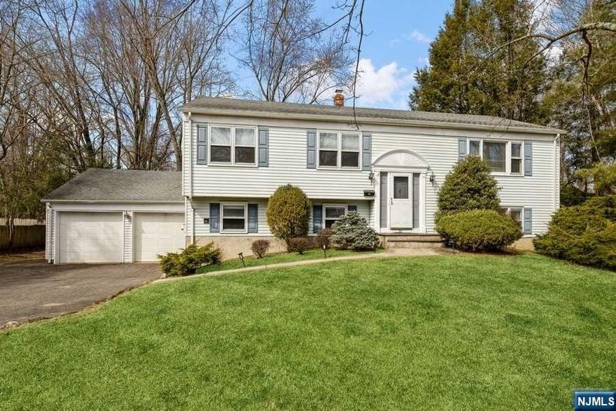 Extended family possibility! This spacious 4 bedroom, 3 bath home with attached oversized 2-car garage is in a beautiful neighborhood of higher priced homes on a 125x150 property. Sun-filled living room; dining room; updated eat in kitchen with granite counters and ss oven range: primary bedroom with bath and 2 double closets plus 2 additional bedrooms and a full bath. The 1st Level features a family room; laundry room; 4th bedroom; full bath; private entry; large unfinished bonus room. New furnace, c/a, water heater, laundry room, kitchen cabinets and countertops in 2021.Harrington Park offers exceptional schools, beautiful parks/playgrounds and a charming small town feel. 5 miles to world class shopping, 11 miles to GW Bridge and 2 miles to Closter's new shopping and restaurant plaza.