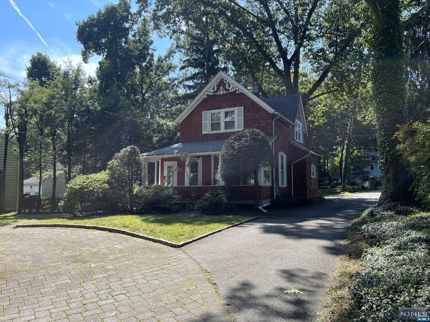 Here is your chance to get into sought-after Ridge school district! This farmhouse colonial has personality & charm with hardwood floors & classic details. First floor complete with living room, dining room, kitchen, den/office with sliders to rear & powder room. Enclosed front & side porches. Central air. 3 bedrooms & 1 bathroom complete the 2nd floor. Unfinished basement. Detached 1 car garage. Circular front driveway. Great opportunity to renovate or build. Close to NYC transportation, parks, schools & more!