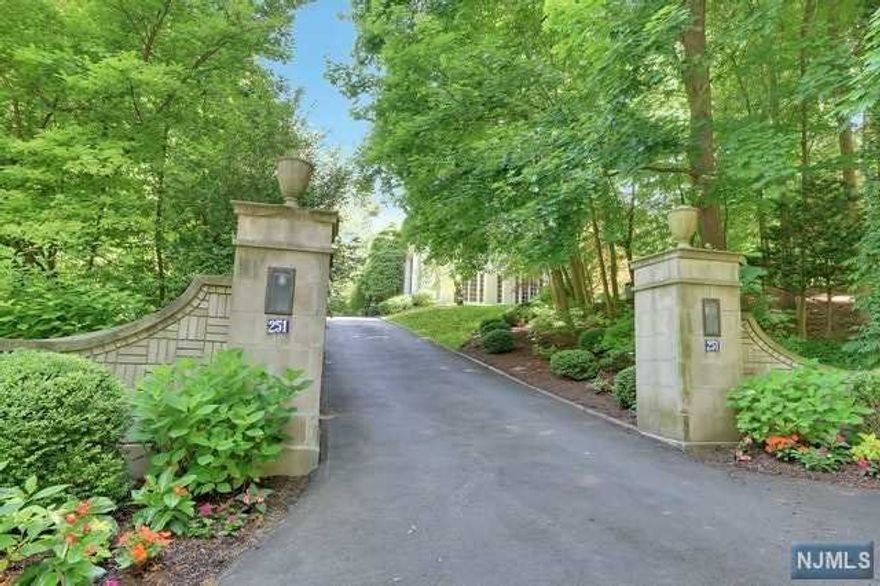 Exquisite Masonry Stucco, Center Hall Colonial, with Incredible Architectural details throughout. As you enter this home, you are welcomed into a Magnificent Entry. Formal Living room, Formal dining room, Mahogany library, beautiful office and light filled solarium. Butler's pantry. Chef's Kitchen, Breakfast area, all with breathtaking views of the property. This home is nestled in a very private, lushly landscaped 1.6 acre property, on a premier Englewood street. In-ground pool, surrounded by Stone patio, and Specimen plantings. This home offers over 8200 sq. ft, of luxurious, living space. The Second floor boasts a Lavish Master Bedroom Suite, with his & her bathrooms plus 4 additional bedrooms and 3 full bathrooms. This is a home, that you don't want to miss! Prime location on the East Hill of Englewood.