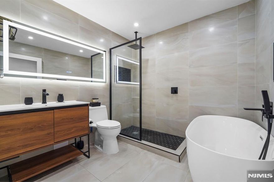 **NEWLY RENOVATED ** LOW HOA ** This recently renovated unit boasts a completely new bathroom with a soaking tub and standing shower, perfect for relaxation. The home features clean natural hardwood floors, new hi-hat lighting throughout, and in-unit laundry for added convenience. With a low HOA fee of just $390, you'll also enjoy one assigned parking spot plus extra guest parking. The complex is dog-friendly and offers stunning NYC views across the grounds. Plus, it's just a few steps away from the NYC bus to Port Authority, making your commute a breeze.