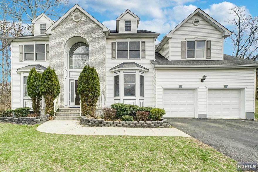 WELCOME HOME TO THIS AMAZING CENTER HALL COLONIAL, ON QUIET CUL DE SAC IN EXCLUSIVE PADDOCK FARMS! APPROX 5000 SQ FT OF LIVING SPACE. GOURMET KITCHEN WITH CENTER ISLAND AND ALL VIKING APPLIANCES. FIRST FLOOR INCLUDES BEDROOM AND FULL BATH, GREAT ROOM WITH FIREPLACE, EAT IN KITCHEN WALKS OUT TO LARGE DECK. SECOND FLOOR HAS 3 LARGE BEDROOMS AND MASTER BEDROOM BOASTING 4 ROOMS, TWO WIC AND LAUNDRY IN MASTER!! LARGE WALKOUT BASEMENT WITH FULL KITCHEN, CENTER ISLAND, 2ND LAUNDRY HOOKUP, EXTRA FAMILY ROOM AND MOVIE THEATRE!!! BEAUTIFUL BACKYARD WITH PATIO AND DECK BACKS UP TO EAGLE ROCK RESERVATION. MINUTES TO MAJOR HIGHWAYS, WALK TO NYC BUS OR JITNEY.