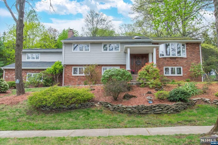 Located on a quiet dead end street, this 5 bedroom Bilevel home sitting on almost an acre features a beautifully updated kitchen and open floor plan- ideal for easy living. On the first floor, you'll find two bedrooms with ample closet space and hardwood floors, the Primary bedroom suite with full bath, 2 walk in closets, private sitting room and deck overlooking backyard. At the ground level, you'll find a large family room with built-ins and gas fireplace, large solarium with skylights overlooking private deck. Also on the ground level a private suite: bedroom, sitting room/office and kitchen with laundry - ideal home office suite or extending living situation. Additional bedroom and full bath with shower stall and plenty of closet storage create extra space for guests, storage and many other possibilities! Muti zone heating and CAC. Oversized heated 3 car garage( has been primarily used as game room and seasonal storage in recent years).