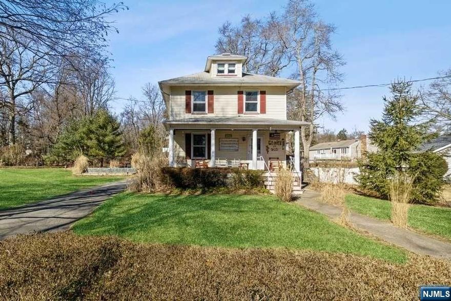 Calling all contractors and builders! Charming Colonial built in the early 1900s set on over an acre of property. Lot is subdividable. Huge open covered front porch is great for sitting outside and relaxing. Huge open tiled foyer area leads into Living Room and Formal Dining Room. Side door entrance to home leads into the Kitchen with walk-in pantry. Basement stairs lead to a full unfinished basement off the kitchen. There is a half bath on the first floor, as well. A dark wood bannister leads to the second floor with 4 bedrooms and a full bath. House needs work. Being sold "As Is". Live in this house and do updates while subdividing lot next door and building. Property and location are outstanding. There is a long private driveway and a garage with a shed. Garage needs a new roof. Public water, sewer, gas heat. Radiator steam heat. No heat in upstairs bedrooms. Location is near Mountain Lakes Border and you are close to NYC transportation, shopping and Mountain Lakes High School