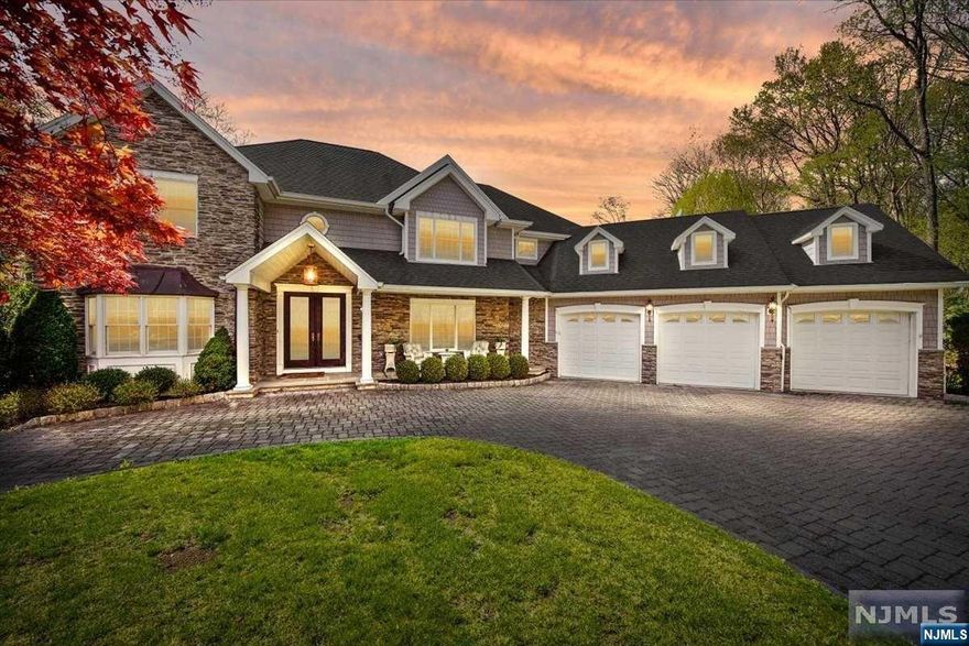 Stop dreaming and start living the life you've imagined in this spectacular home located in the Ramsey Golf and Country Club. This incredible location provides sweeping views of the beautiful landscape and lake. This is where luxury meets casual style in a sophisticated design. From the 2-story foyer to the massive wall of picture windows, this home impresses at every turn. Entertain in elegance in the formal DR. The chef's kitchen awaits your culinary imagination while mingling w/guests as they relax in the great room with an impressive fireplace and breathtaking views. Enjoy the welcoming sunroom bathed in sunlight or the evening stars. Keep the party going in the finished lower level with 9' ceilings and wet bar or take it outside to the spacious deck and paver patio where you can enjoy the spaciousness of this nearly 2-acre property. This home truly has it all! Now you can too! WANT MORE INFO? CONTACT LISTING AGENT NICOLE MINETTI @ 201-388-0077 or nicole@minettidennisgroup.com