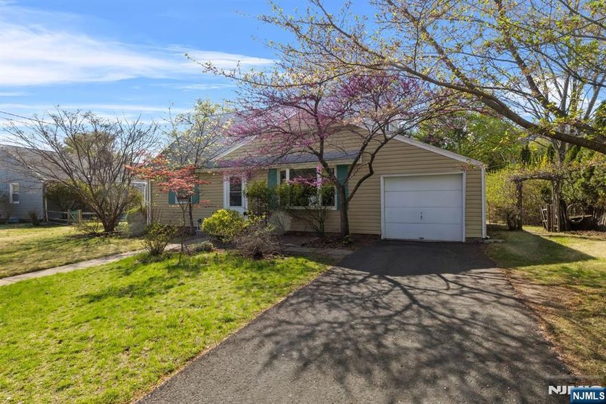 Welcome to your new home in Ridgewood! This absolutely charming, expanded Cape Cod is located on a serene, tree-lined side street, close to downtown Ridgewood and just steps to Ho-Ho-Kus Village. The front entrance leads into a spacious living room. The large bay window ushers plentiful sunlight into this wonderful space. A renovated kitchen boasts granite countertops, tile backsplash and cherry cabinets. A wall of windows overlooks the backyard, and ushers additional, plentiful sunlight into this space. Serve meals and regale family and guests in the adjacent dining room. The mudroom provides direct access to the garage, and back patio. There are two large bedrooms on this first floor, and a stylish tile hall bathroom. The second floor provides two more spacious bedrooms, and another updated, gleaming tile bathroom. The finished portion of the basement provides additional living space (playroom, home office). The basement also provides laundry and storage space. The property is nearly 9,500 square feet, and provides generous outdoor recreation & entertainment space, as well as potential to expand this home's footprint. Commuters will have the luxury of access to both Ridgewood and Ho-Ho-Kus train stations.