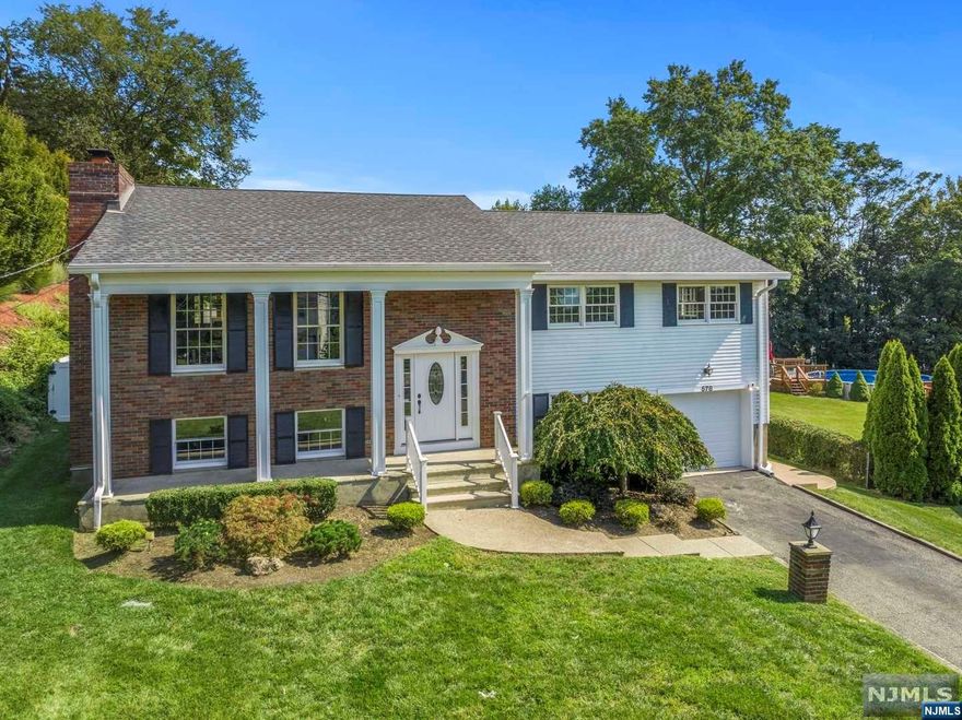 Welcome to Perfection! Embrace the pinnacle of luxury living in the sought-after Totowa neighborhood! Discover a remarkable 4-bedroom, 2.5-bath bilevel home . As you step into the main level, you're greeted by a harmonious fusion of spaces designed for both relaxation and entertainment. A welcoming living room, an elegant dining area, and a beautifully appointed eat-in kitchen. The master bedroom, featuring its own full bath. Two additional bedrooms share a thoughtfully designed full bath in the hallway. Not to be missed, the delightful sunroom opens up to a sprawling deck. Descend to the ground level - An expansive rec room, an additional bedroom adds versatility to the layout, perfect for guests, an office, or a hobby space. A convenient half bath and a well-placed laundry room complete this level. Outdoors, the allure continues with a fenced-in backyard that's a true oasis. The heated inground pool invites you to indulge in luxury and relaxation.