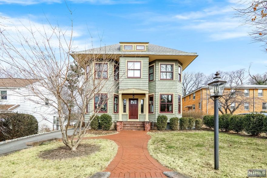 Prepare to fall in love with this classic Colonial, filled with charm & character! The paver walkway & vinyl cedar impressions combined w/ a stone front greet you as you approach. Plenty of beautiful woodwork & hardwood floors...the office is filled w/ natural light; exposed brick, completed w/ a full bath. Formal dining room has a bay window & can host large parties. Exquisite kitchen finds a granite island, more exposed brick, hardwood floors, S/S appliances...walk-in pantry also hosts the laundry space. Expansive family room opens from the kitchen, w/ a wall of brick; gas fireplace, vaulted ceilings & recessed lighting. Walk down to a mud room area, coming off the driveway & go down to the finished basement/rec room which contains a half bath. 2nd level finds 3 gracious bedrooms & tons of closet space. The backyard has a paver patio, 2 car detached garage. Lush landscaping & garden, fountain, moonlit tree lighting. This magnificent home leaves you nothing to do but enjoy!