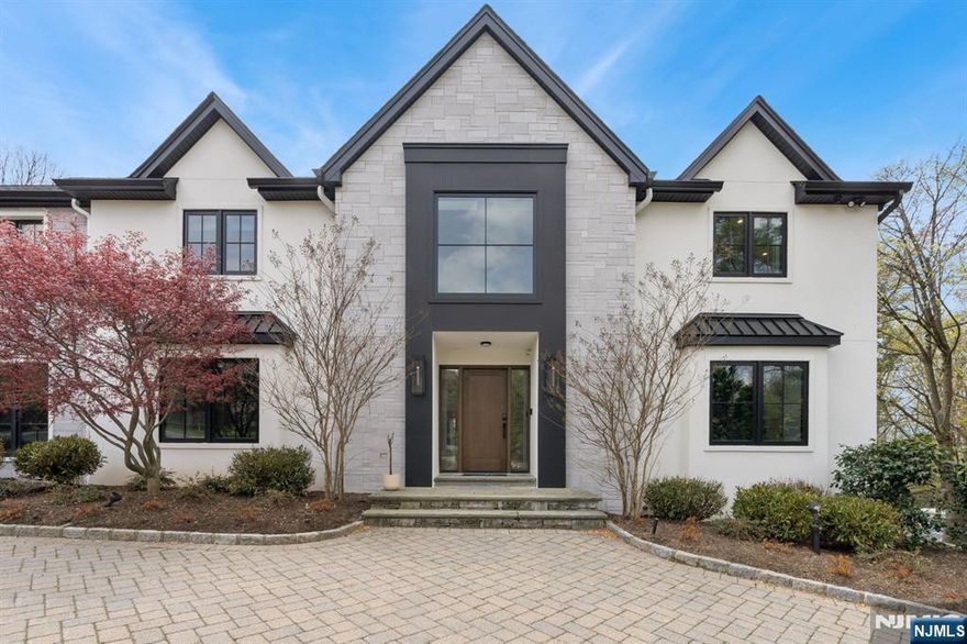 Stunning fully renovated home on one acre in Cresskillâ€™s desirable Tammy Brook area. This luxurious property features new masonry stucco, windows, radiant white oak wood flooring throughout whole house on the first floor and second floor, and top-of-the-line finishes throughout. The first floor boasts formal living & dining rooms, a vaulted great room, new chefâ€™s kitchen with Viking appliances, two dishwashers, bar room, mudroom, full bath & powder room, plus a 3-car heated garage. Upstairs offers a vaulted primary suite with new spa-like bath, four additional bedrooms, two full baths, new laundry, and a family room. The full finished basement includes a bedroom, full bath, gym, play area & storage. Outside: new patio, outdoor kitchen, gas firepit, pool & hot tub. A must see!