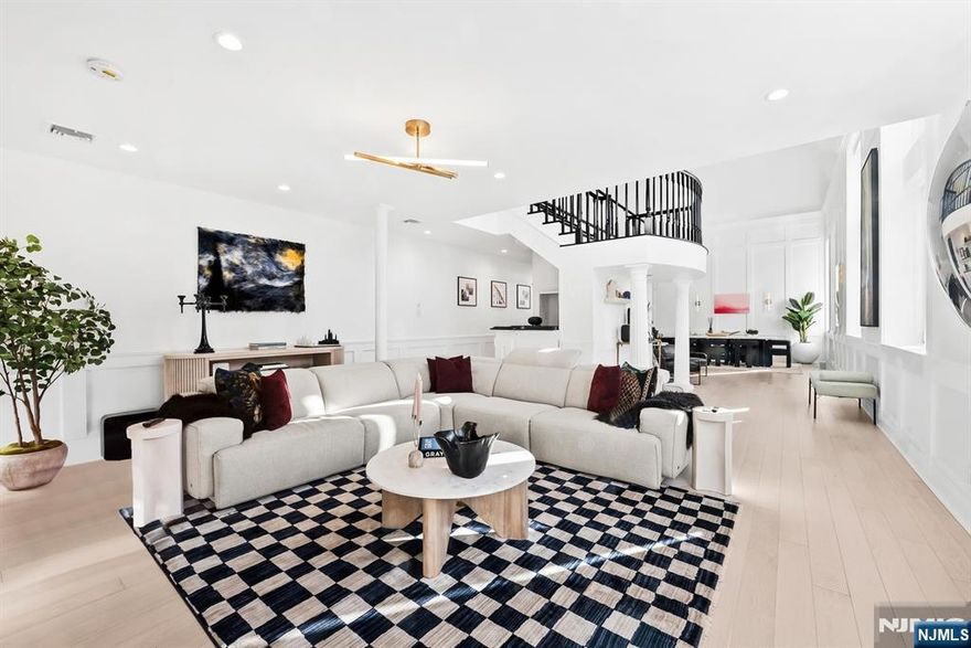 ** 3 CAR GARAGE PARKING ** 1101 Bloomfield isnâ€™t just a condo, it lives like a private townhouse in the heart of uptown Hoboken. Set within a beautifully preserved 19th-century building constructed in the 1800s, this rare 5-bedroom, 3.5-bath residence blends historic character with a fully gut-renovated modern interior. Thick masonry walls and original craftsmanship provide exceptional durability, privacy, and remarkable sound insulation â€” creating a quiet retreat unlike anything else in town. Taken down o the studs and thoughtfully redesigned, the home offers expansive proportions rarely found in Hoboken. All five bedrooms are generously sized, including Feng Shuiâ€“inspired childrenâ€™s rooms featuring custom lofted spaces that create cozy nooks for reading, play, and sleepovers. A hidden playroom or lounge tucked behind the main living area adds a magical bonus space perfect for a media room, office, or retreat. The open living and entertaining areas are complemented by a distinctive custom bar, top-of-the-line appliances, custom flooring, built-ins, and exceptional closet space throughout.enâ€™s desirable uptown side, a quieter, more residential setting with zero flood risk, this home offers rare peace of mind along with extraordinary convenience. Three private garage parking spaces (an extreme rarity), dedicated bike storage, a private storage cage, and potential for a wine cellar in the basement complete this one-of-a-kind offering.