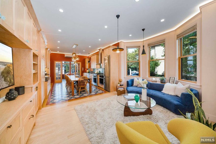 Custom crafted, fully renovated, down-to-the-studs, 2-Family 'English Tudor has it all! Splendor in Weehawken comes with is this beautiful home, conveniently nestled on a large corner lot, close to the park & township reservoir, boasting with exquisite features and details throughout. Enter a stylish foyer with vintage mosaic tile flooring, leading to both units and basement access. Unit 1 features 2 Bedroom, 2 Bathroom with a bi-level, open floor plan layout, complete with a large gourmet kitchen, natural wood cabinetry with amble storage, built-in buffet, quartz counters, high-end stainless-steel appliances. The oversized lavished main bedroom with an en-suite Bathroom, 2nd bedroom with a custom built-in Murphy Bed, plus the stylish Living room with built-in entertainment center and alcove Den create a warm and inviting space.