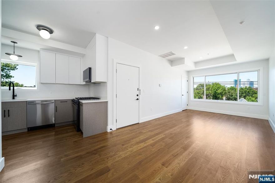 Welcome to the crown jewel of 67 Virginia Avenue. Unit 4 sits at the top of this brand-new boutique walk-up, offering over 1,000 sq. ft. of light-filled living space with modern finishes and elevated design. Perched above it all, this premier residence combines privacy with style â€” high ceilings, open concept living, and oversized windows that flood the space with natural light throughout the day. Inside youâ€™ll find all the comforts of new construction: smart appliances, in-unit laundry, a dishwasher, and heated bathroom floors. The ButterflyMX virtual doorman system keeps packages secure and adds peace of mind. Step outside and youâ€™re just a 3-minute walk to the MLK Light Rail, putting you in Manhattan in less than 30 minutes. Grocery shopping, dining, and parks are all nearby, and Liberty State Park is only minutes away, offering sweeping views of the Statue of Liberty and a quick drive to Liberty National Golf Club. Unit 4 is the most desirable home in the building â€” filled with light, unmatched privacy, and no one above you. Donâ€™t miss this chance to own a piece of Bergen-Lafayetteâ€™s growing story. All forms of income are accepted in accordance with New Jersey Fair Housing Laws. Vouchers and assistance programs are welcome.