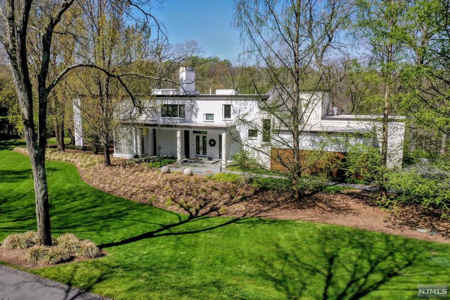 269 E Saddle River Rd is a Modern Dream. Perched in the treetops with views of the Saddle River Valley from every inch of the floor to ceiling, 10-foot wall of windows, all along the rear of the home. Some would say this home brings nature into your life while also being meticulously designed with its clean lines and a breath of elegance. Every season is seen in its raw beauty. 1st floor offers 10-foot ceilings, Foyer, Custom Fireplace. Living room, Sitting room, Dining room, Large Modern Kitchen with double fridges, two dishwashers, multiple islands adjacent to the Family room. Powder room, Pantry, Mudroom hallway and Elevator. 2nd floor offers a Master Suite with his and her bathrooms, two large walk-in closets and breath taking views. Second bedroom has an En-suite bathroom, walk in closet. 3rd and 4th bedrooms both share the same spectacular views and a bathroom. Basement is full, finished with rec room and full bath. Decks, Blue Stone patios, Generator. Hot Tub.