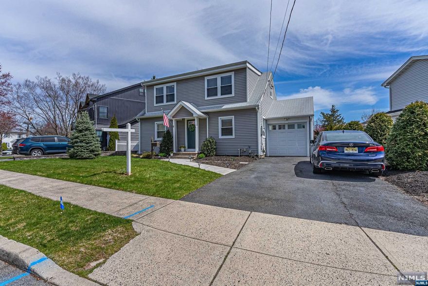 Welcome to this Charming home with curb appeal, attached garage in a very desirable area of Clifton. Step inside, hang your coat in the coat closet and make yourself comfortable in the cozy living room, opposite the living room is a bonus room with french doors leading to the dining room. Hardwood floors through out. The work- in kitchen is updated with granite countertops, subway tile back splash and tile floor. Half bath on first floor. On the 2nd level you will find your three Bedrooms. All bedrooms have large closets. Primary Bedroom offers a full bath, Additional full bath in hall. Hardwood floors on 2nd level as well. The Washer & Dryer is located on 2nd floor. Full basement high ceilings can be finished for additional recreation space. Large Back yard for entertaining on those summer nights. This has a sprinkler system. This home is close to public transportation, shopping as well as all major highways. The home was renovated in 2017.