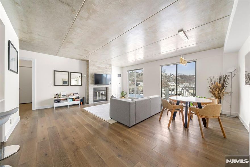 Experience luxury living in this fully renovated penthouse at The Admiral's Walk a prestigious gated community offering unmatched elegance and amenities. This sophisticated residence features sweeping views, hardwood floors, and grand 9-foot ceilings. Enjoy a full suite of amenities including a 24-hour concierge, fitness center with Hudson River views, clubhouse for entertainment, picnic areas, sauna, tennis and basketball courts, and shuffleboard. The spacious 1-bedroom, 1.5-bath layout provides comfort and style, and is conveniently located within walking distance to the Edgewater Ferry, with NYC transportation just steps away. Shopping and conveniences are nearby, and one dedicated outdoor parking spot #9 is included. "For Private tour, Text/ CALL to Sunny S. Hwang (Re/Max Now)"