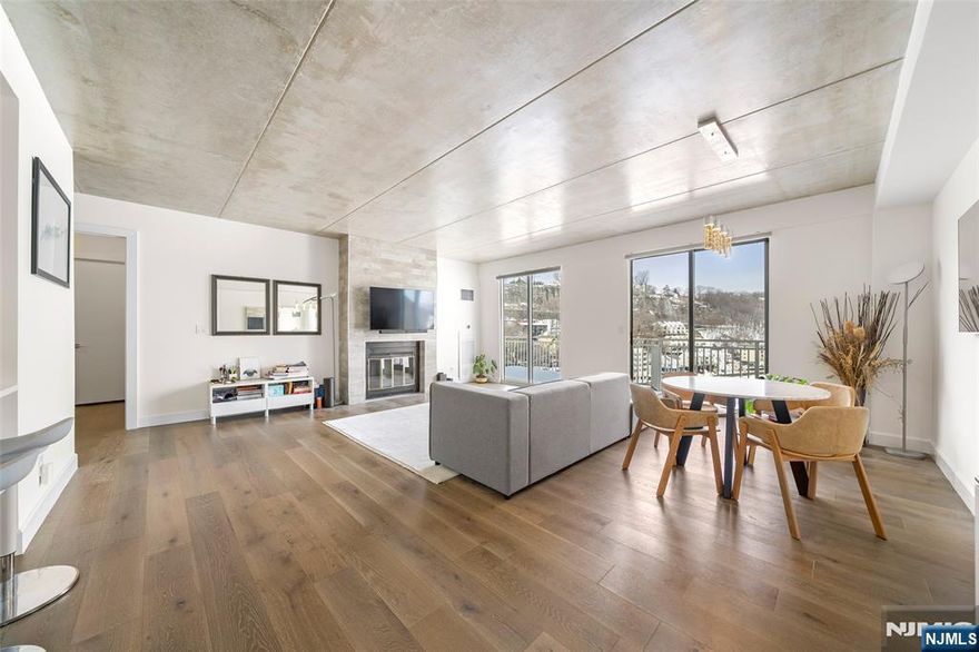 Experience luxury living in this fully renovated penthouse at The Admiral's Walk a prestigious gated community offering unmatched elegance and amenities. This sophisticated residence features sweeping views, hardwood floors, and grand 9-foot ceilings. Enjoy a full suite of amenities including a 24-hour concierge, fitness center with Hudson River views, clubhouse for entertainment, picnic areas, sauna, tennis and basketball courts, and shuffleboard. The spacious 1-bedroom, 1.5-bath layout provides comfort and style, and is conveniently located within walking distance to the Edgewater Ferry, with NYC transportation just steps away. Shopping and conveniences are nearby, and one dedicated outdoor parking spot #9 is included. "For Private tour, Text/ CALL to Sunny S. Hwang (Re/Max Now)"