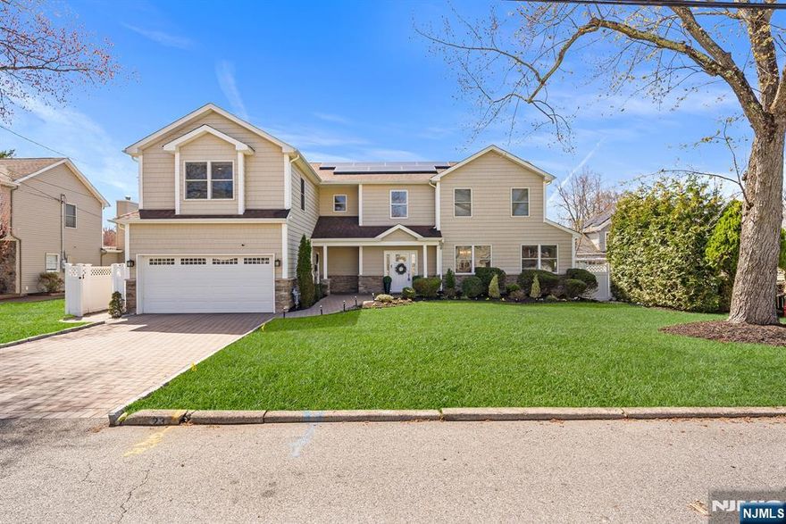 Welcome to this beautifully updated Custom Center Hall Colonial nestled in a desirable residential neighborhood in Emerson, NJ. This spacious home offers 5 generously sized bedrooms & 3.5 bathrooms, thoughtfully designed for both comfort & functionality. A grand two-story entry foyer sets the tone, leading into an open floor plan that seamlessly blends everyday living & entertaining. The inviting living areas are anchored by a cozy gas FP, creating a warm & welcome atmosphere on the main level. Thru-out the home, you'll find gleaming hardwood floors & freshly painted interiors in soft, neutral tones that enhance the abundance of natural light. The EI-Kitchen is a true centerpiece, featuring stainless steel appliances, elegant granite countertops, pantry & ample cabinetry for all your storage needs. The first level includes a convenient guest suite, complete with shower access, ideal for visitors or extended living. Upstairs, the Primary Bedroom Suite offers a private retreat with a separate sitting room, abundant natural light & a spacious ensuite bath. Energy saving (owned) Solar. Enjoy a fully fenced backyard oasis featuring a brand-new gazebo, multiple storage sheds, & plenty of room for outdoor gatherings or relaxation. Highly rated Emerson schools. Exceptionally well maintained & ideally located close to NYC transportation via NJ Transit Pascack Valley Line trains & buses. This home perfectly balances suburban comfort with commuter convenience. This one won't last.