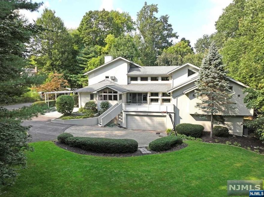 Down a secluded private lane, a world apart, sits this exceptional contemporary home on 1.18 acres with inspired architectural detail. Soaring ceilings and abundance of windows allows for light and nature to become part of your interior. The outdoors beckon come escape to your heated inground pool and private gardens. Find solitude in the grand primary suite with cathedral ceiling, open sitting area, bathroom with steam shower, jetted tub, dressing area, 2 WIC, and private deck overlooking the tranquil horse farm next door. The renovated eat in kitchen with granite counters, custom wood cabinets & newer appliances invites even the most novice cook to play in the kitchen! Radiant granite floors in the living room, primary bedroom, bathroom and lower level maximize your comfort. One of a kind retreat, not to be missed. Generac generator w/automatic transfer, Tesla Super charger 60 Amps and the complete VIVANT home security system are just some of the upgrades this home has to offer.