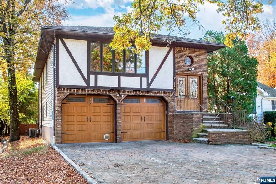 Welcome to this meticulously crafted custom-built home, cherished by a single owner and ideally situated in a prime location. From the hand-laid paver block driveway and charming patio to the thoughtfully designed interior, every detail of this home exudes quality and care. Upstairs, you'll find hardwood flooring, three spacious bedrooms, two full bathrooms, a formal dining room, and a generous size eat-in kitchen. The lower level offers a private entrance, an additional fourth bedroom, a full bathroom, and ample space for a den or family room. This home is conveniently located near major highways, public transportation, and an array of fantastic dining and shopping options. Flood insurance may be required but owner states home has never flooded!