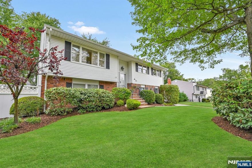 This beautifully designed residence offers a harmonious blend of modern efficiency and timeless comfort. With 4 spacious bedrooms and 2 full baths, this charming home provides ample space for everyone! The main floor features a living room, formal dining area, eat-in kitchen equipped with updated appliances and contemporary finishes, 3 bedrooms, and a full hall bathroom with direct access to the primary bedroom. The fully finished lower level presents flexible living arrangements, perfect as an in-law suite, extended living area, or guest accommodations. It boasts a family room, sitting room that opens to a full kitchenette, bedroom, full bathroom, and washer/dryer. The primary bedroom can be located on either level, offering versatile living options. Enjoy low taxes and close proximity to parks, schools, shopping, and NJ Transit stations, with easy access to major highways. This lovely home is ready to accommodate all of your needs!