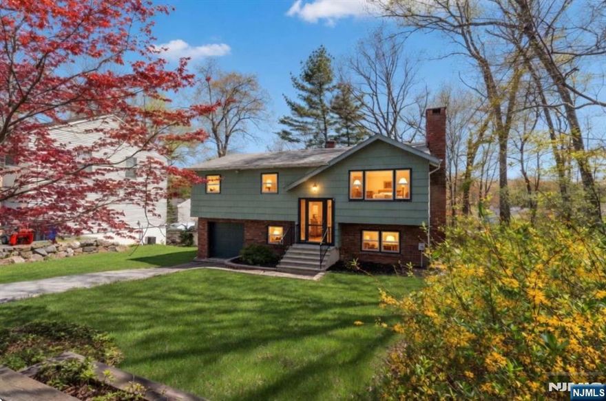 **SELLER IS OFFERING A $30,000 CREDIT TO THE BUYER AT FULL ASKING PRICE OR ABOVE, TO BE USED TOWARD NEW ROOF, DOORS AND WINDOWS.** Discover this welcoming 2-story single-family home in the desirable Hopatcong Hills community. Underneath the carpeting in the living room, dining room, upstairs hallway, and bedrooms are beautiful solid hardwood floors ready to be revealed. Inside you'll find a bright eat-in kitchen with oak cabinets, a cozy living room with brick fireplace, a wood-paneled secondary living room with wood stove, multiple bedrooms (one currently a nursery), updated bathrooms, laundry with W/D, and an attached 2-car garage. As part of the Hopatcong Hills HOA, residents enjoy access to the community beach house, private lakefront privileges on Lake Hopatcong, maintained common areas, and recreational amenities. Just minutes from the Lake Hopatcong NJ Transit train station and close to Hopatcongâ€™s top attractions including Lake Hopatcong and Hopatcong State Park. A solid home in a prime lake-area location with excellent potential!