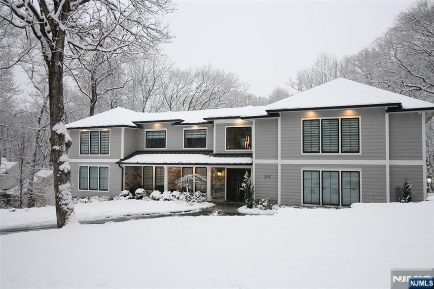 A true statement of luxury, this fully reimagined three-story Colonial at 315 Freemans Lane sits on a beautifully landscaped one-acre property in a premier neighborhood and was rebuilt in 2024. Offering 6 bedrooms and 6.5 bathrooms, the home masterfully blends timeless elegance with modern luxury. Highlights include multiple fireplaces, porcelain and ceramic flooring throughout, and a dramatic grand foyer that opens into expansive, light-filled living and entertaining spaces. The chefâ€™s kitchen is truly a showpiece, featuring an oversized island, quartz countertops, custom cabinetry, a striking brass-accented range hood, farmhouse sink, walk-in pantry, and an additional coffee/bar room ideal for entertaining. The first floor also offers a bedroom and a separate office, each adjacent to a full bathroom, providing excellent flexibility for guests, extended family, or work-from-home needs. The second level is anchored by a luxurious primary suite retreat with a sitting area, an impressive two-story walk-in closet, an additional walk-in closet, and a spa-inspired bath. Two additional ensuite bedrooms and a conveniently located laundry room complete this floor.