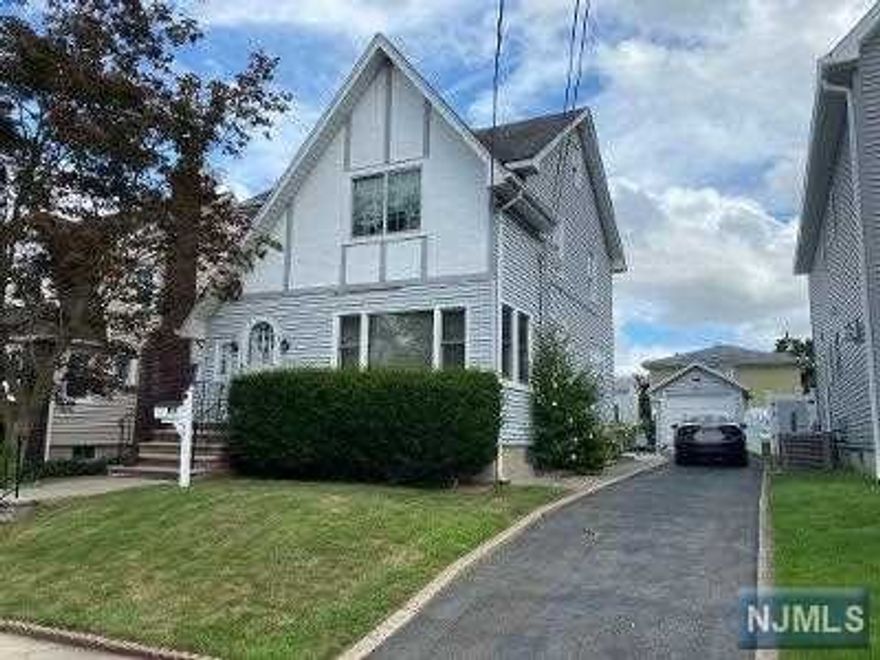 Situated in the heart of the North Arlington Manor this charming colonial is conveniently located close to NYC transportation, major highways and shopping. This lovely home features an entry foyer, spacious living Room and formal dining Room with beautiful chestnut trim and hardwood floors, Kitchen, 3 bedrooms and a modern ceramic tile bath. There is a full walk up attic and a full semi finished basement. Amenities include gas heat, trek deck off the kitchen, newer windows and hot water heater, recently relined chimney, 1 car garage and long driveway for 3 cars. MASKS required