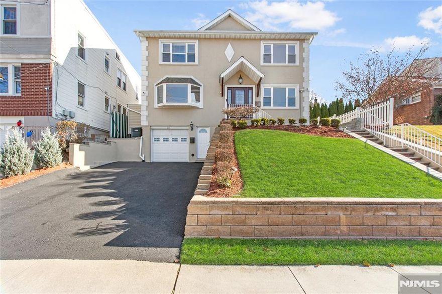 WOW WOW WOW ... STUNNING CUSTOM COLONIAL HOME on a DEAD END STREET near EVERYTHING .. PARKS, SCHOOLS, SPORTS COMPLEX, NEW YORK BUS to TRAIN, Shopping Complex with Top Box Franchise Stores with Fine Dining Restaurant etc. This AMAZING curb appeal HOME has many APPEALING FEATURES that includes 3 entrance home, 4 car Driveways, 1 car attached tiled garage, 2 zone central heat & air new retaining walls, well groomed lawn & shrubs fence all around property, shed, flat yard, 2 level paved yard, and security camera all throughout. A MUST VISIT!