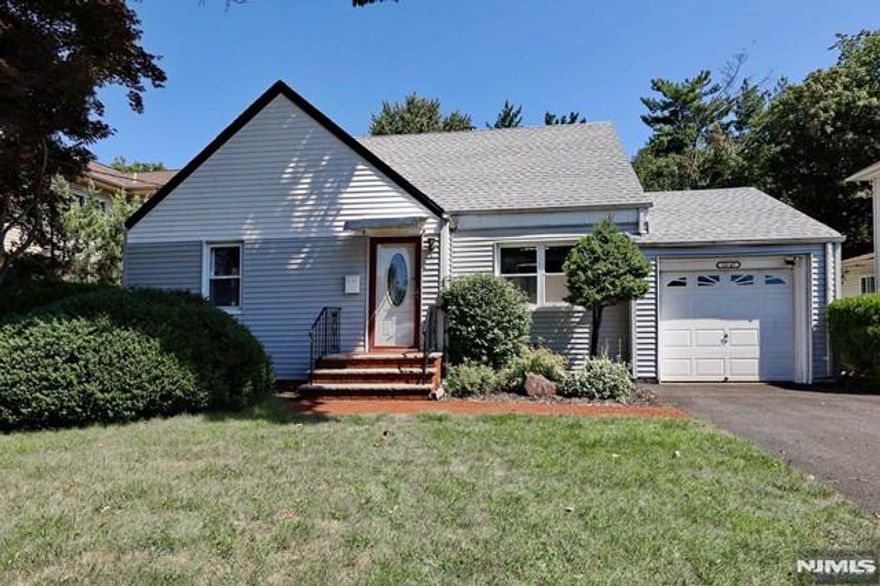 Welcome to this beautiful 3-bedroom, 2.5-bath home in a prime location! The first floor features an entry foyer, living room, a large eat-in kitchen with stainless steel appliances, a spacious family room with sliding doors to the patio, two bedrooms, and a fully updated bath. The second floor offers a large bedroom and a full bath. The beautifully renovated basement includes a large rec room, half bath, and laundry area. Hardwood floors on the first floor, an attached garage, and a great backyard with a large patio. Conveniently located near houses of worship, NYC trains, shopping, the library, and the town hall. This property also has great potential for future improvements. Don't miss out on this fantastic opportunity!