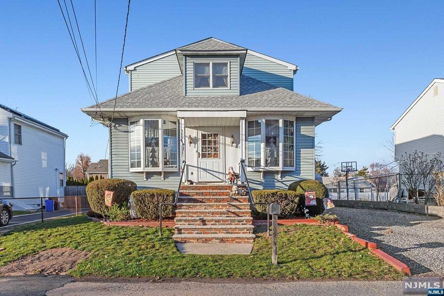 Step onto the stoop and through the front door and you instantly feel like home. It's warm and charming with hardwood floors and lovely architectural details that you just can't find anywhere today. Lovely, large property on a quiet, tree-lined street. It all adds up to a perfect Home for the Holidays. Make it yours!