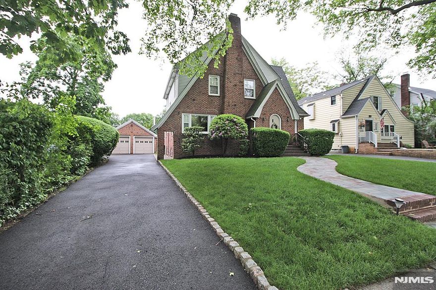 Large and rare storybook Tudor combining charm and convenience. Located on quiet, mature tree lined street. You will enjoy close access to the Yanticaw Park. This home blends function and style with comfortable flowing layout. Exceptionally spacious 1st floor features Living room with fireplace, and adjacent TV room with powder room. Expansive Formal Dining Room leads into spring through fall enclosed porch and walkout to private back yard oasis. Large eat in kitchen has access to the rear deck, perfect for relaxing and entertaining. Second floor features Master Bedroom with full bath, 2 bedrooms big enough to accommodate large sets, and main bath. Third floor is great for an abundant storage and playroom or office. Basement is ideal for hobbies, exercise or spacious rec. area. Also, there is a laundry room and half bath. Large detached 2 car garage with storage. Long driveway repaved last year. Fireplace and chimney sold "as is condition with no known issues.