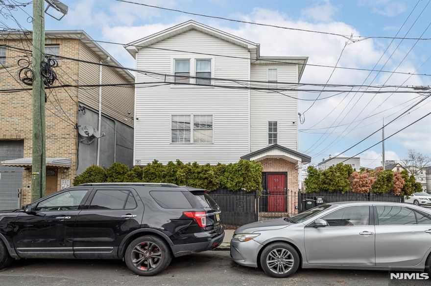 Excellent Investment Opportunity in this sprawling 2 Family Home in thriving Newark! Situated on a corner lot, well maintained, offering over 4000+ sq ft of finished living, 7 Bedrooms, 5 Full Baths, a Bonus Space & Laundry Area. Upon entrance of Unit 1 you will find 3 generous Bedrooms w/hardwood flrs, including the primary suite. Primary Bedroom features its own private ensuite bath. The Eat in Kitchen offers ceramic tile flrs & backsplash + a plethora of cabinetry & dinette space. Main full bath w/ceramic tile flr & tiled tub shower. The spacious Living Rm features recessed lights, crown molding, & french doors that give way to a large deck. The 2nd Unit holds 3 generous Bedrooms w/hardwood flrs, including the primary suite. Primary Bedroom features a walk-in closet & its own private ensuite bath. The Eat in Kitchen offers ceramic tile flr & backsplash + a plethora of cabinetry & dinette space. Main full bath w/ceramic tile flr & tiled tub shower. The spacious Living/Dining Combo offers hardwood flrs & recessed lights. Finished lower level offers a Bedroom, Full Bath, Laundry hook up, and a versatile bonus space. 1 car garage & double wide driveway offers plenty of parking, fenced in for your privacy. Semi-private entrances, separate utilities, & a prime commuter location, just steps to the bus line, easy access to major roads, close to parks, shopping, dining, & more! Don't miss out! This could be the hidden gem you've been searching for!