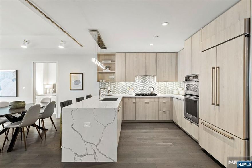 (Contact NELSON CHEN at 2 0 1 - 8 8 6 - 8 0 0 0) - AVORA at Port Imperial - RESIDENCE 317 is a truly impressive home boasting 1512-SF with two bedrooms, a glass-walled balcony facing south and a full-size BONUS ROOM that serves as a perfect home office or formal dining room. This ideal split-bedroom wing floorplan has gracious room proportions that are complimented by beautiful wood floors, exquisite porcelain and stone finishes in the kitchen and baths, Kohler and Robern fixtures and fittings, custom designed lighting and ceilings over 9-feet tall. If you need closet space, look no further! This home has ten custom fitted closets including an in-unit storage room. Building amenities include 24-hour concierge service, health club, media room, sports simulator, resident lounges and the amazing pool deck & barbecue patio. Avora residents enjoy the transit hub offering ferry, light rail & bus service literally steps from the lobby door. Come experience living here! - (Presented by THE CHEN AGENCY, 2 0 1 - 3 4 6 - 8 8 8 8, N e l s o n @ C h e n A g e n c y . c o m)