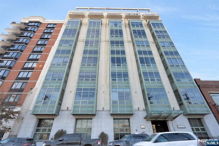 This exquisite one-bedroom, one-full-bathroom condominium is situated within the contemporary boutique-style Zephyr Lofts. The spacious unit features hardwood flooring, abundant natural light, and breathtaking views of New York City. Renovations, totaling $30,000, include a modern bathroom, a new Trane HVAC system, kitchen appliances, and custom wooden blinds. The building offers a comprehensive range of amenities, including a 24-hour concierge, a gymnasium, bike storage, and a spacious courtyard equipped with barbecues. Located on the border of Jersey City and Hoboken, this unit provides convenient access to shopping and expedited travel to New York City via PATH and bus services. Parking garage space in building subject to availability and additional fee through Management Company. Note that pictures are prior to current tenant occupancy. Renter's Insurance required. This property is also available for sale MLS#25028069.