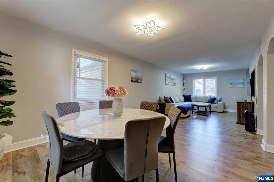 Welcome to this stunning four-bedroom, 2.5 bath home in the heart of Bogota, NJ! Perfectly located just 20 minutes from the city and close to all major highways for New York and New Jersey transportation, this home offers the ultimate convenience for commuters. The first floor boasts a spacious living room, a dining room perfect for entertaining, and a large, beautiful kitchen with modern quartz countertops ,full bath and a bedroom.Upstairs contains the master bedroom with a large walk in closet, two additional closets and a door to the oversized balcony/deck right off the master bedroom! There are two more generously sized bedrooms with plenty of closet space, and another full bath. Outside, the property features a driveway, garage, and large backyard. Home has two zone central AC and heat with smart thermostats. Close to parks, schools, and local amenities, this home is ideal for those seeking both comfort and convenience.Bus to NY is in River rd down the street from the house.