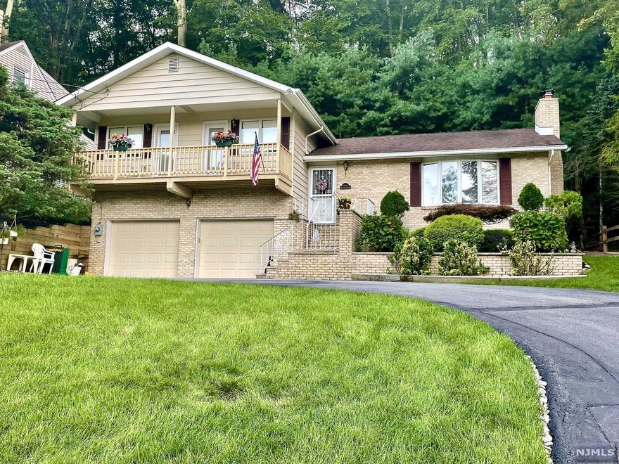 Here is your opportunity to own this picture Perfect Inside and Out 3 Bdrms, 3 and 1/2 Bath Split Level- Lower Level Family Rm w/Fireplace and Wet Bar, utility rm, Full Bath and entrance to attached 2 car garage w/plenty of storage - Main Level has Entrance Foyer with double closet, and 1/2 Bath - Liv Rm w/Fireplace and large Picture Window, Mod Kit w/Granite and breakfast bar, Dining Rm w/Ent to tree Deck - 2nd level has 2 bedrooms with double closet and entrance to Balcony - Master Bedroom with Full Bath, and ent to huge Florida Rm and Entrance to Back Deck - Beautiful Private Wooded Property (10,367 Sq Ft) - Create your own private Retreat - Amenities include BB Zoned Heat, Central Air, Oversized 2-Car Garage - .9 miles to Pines Lake Elementary School, Middle School Schuyler Colfax and Wayne Hills High School