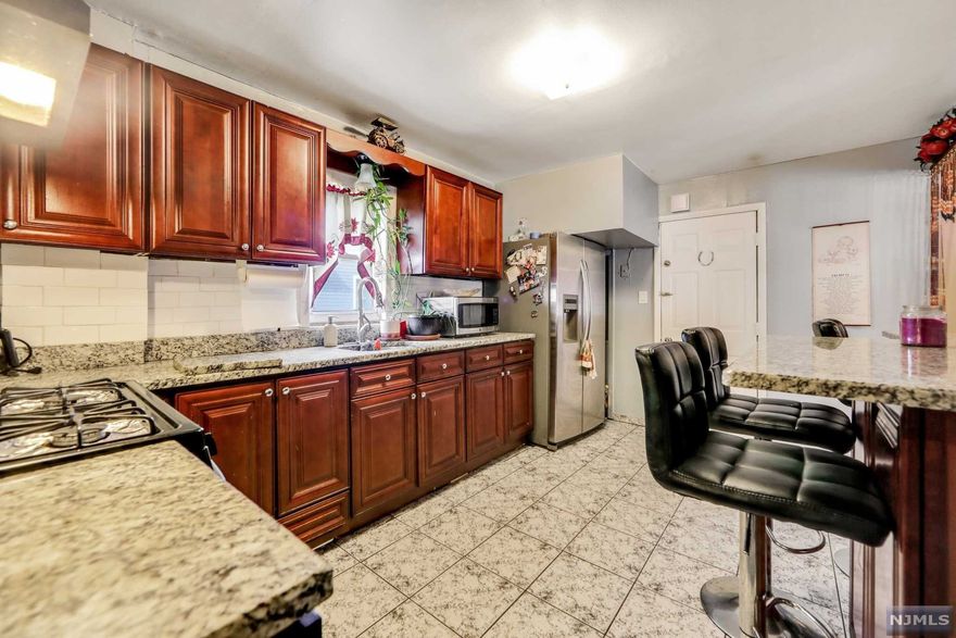 Great investment property sitting on a 50 x 100 lot just one block from Blvd East! This 2-Family is very large and versatile, whether you are looking to occupy one unit and rent the second one or you are an investor and would like to collect rent from both units. The main level has 2 large bedrooms, renovated eat-in kitchen with granite counter tops, a living room, and one bathroom. The second level has 3 bedrooms, living room, and kitchen. Additionally, this property boasts a finished attic and a finished basement, 2-car garage, a very long driveway, backyard and a detached area used as a recreational room. Ideal location close to public transportation, shops, restaurants and the fantastic NYC skyline and river views