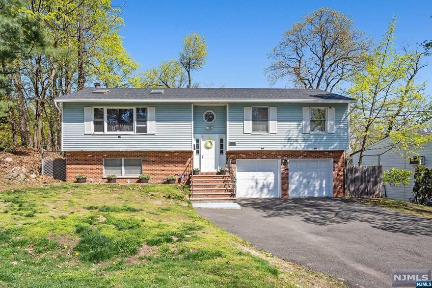 Large Bi-Level w/4 BRs & 3 Full Bathrms, over 1,800 sq ft of living space plus rec rm, on 1/4 acre property! Open layout from large living rm into dining rm & into kitchen. Kitchen is large & has great potential to design your update. Large sun rm attached!3 BRs on upper flr plus primary BR w/ensuite Full Bathrm. Lower level has large BR plus bonus dressing rm/gym area & 2nd walk in closet! Note: 2 car garage has been converted to extra living space & currently has a large rec rm w/pool table & bar! But could be converted back to 2 car garage if preferred. But the driveway is so large it houses 8+ cars! The backyard is large w/an above grd pool (new pool liner provided - just needs buyer to install). Under deck patio, space for BBQs, & tons of potential to customize your backyard to your own designs! New roof (2021). Central AC in place but not currently functioning. House sold as-is pending limited inspection allowance (structural & environmental requests only) Great potential!